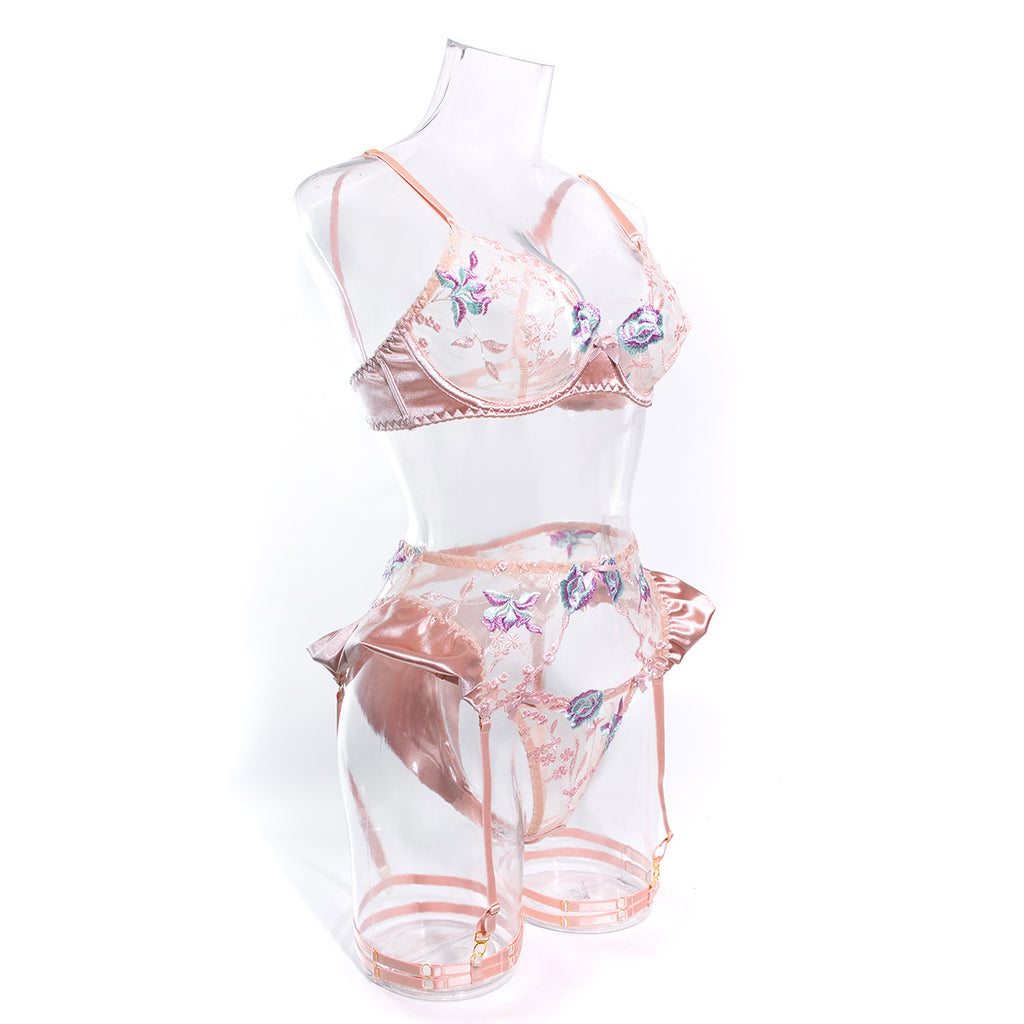 Side view of the Blush Pink set. Capturing the delicate transition between the sheer mesh embroidery and the lustrous satin side-detailing.