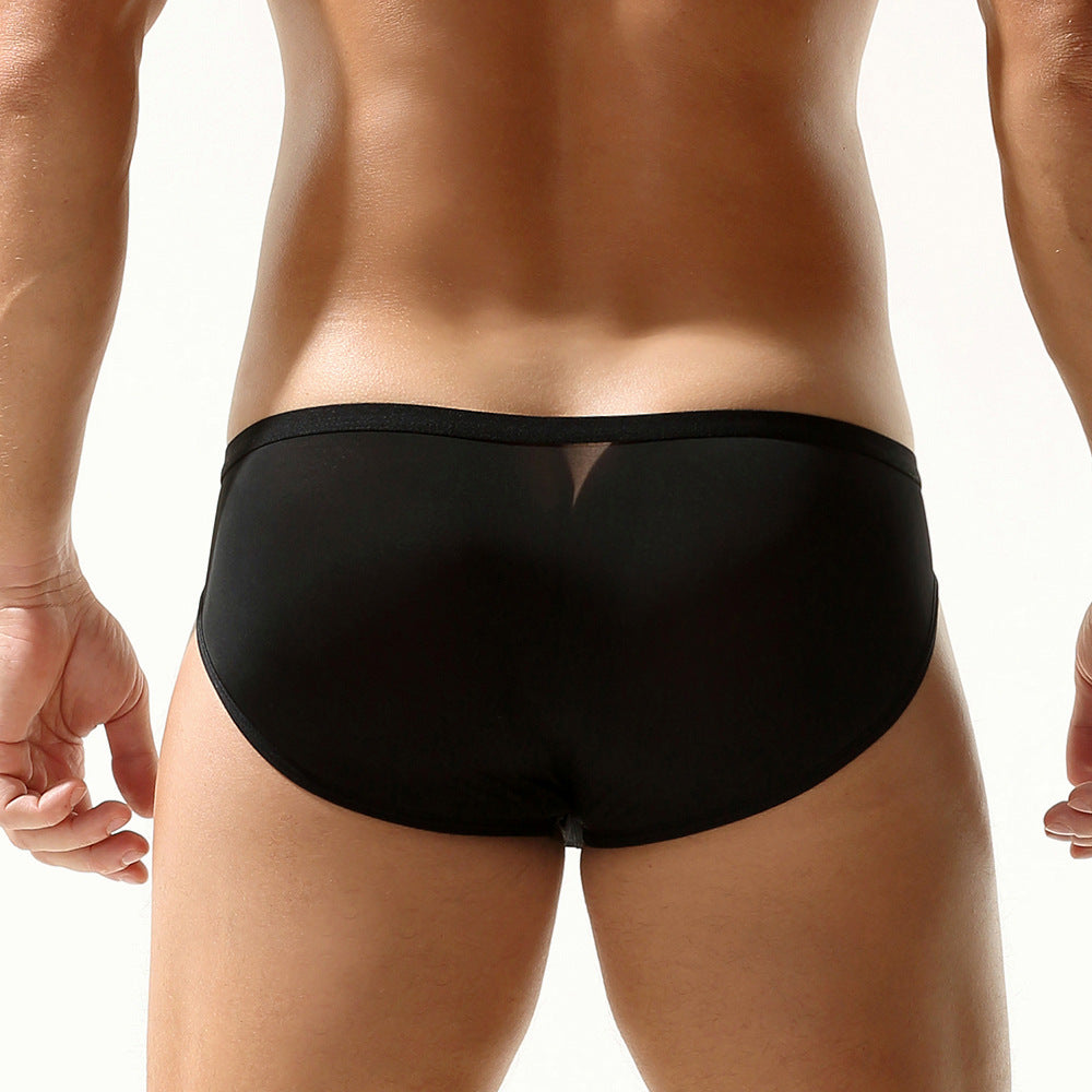Rear view of an athlete in black mesh briefs; low-profile waistband and seamless seat coverage.