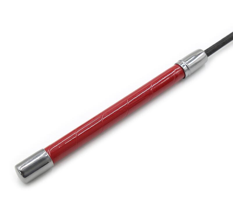 Detail of the streamlined, high-shine red patent leather handle featuring a chrome-finished end cap for balanced weight and control.