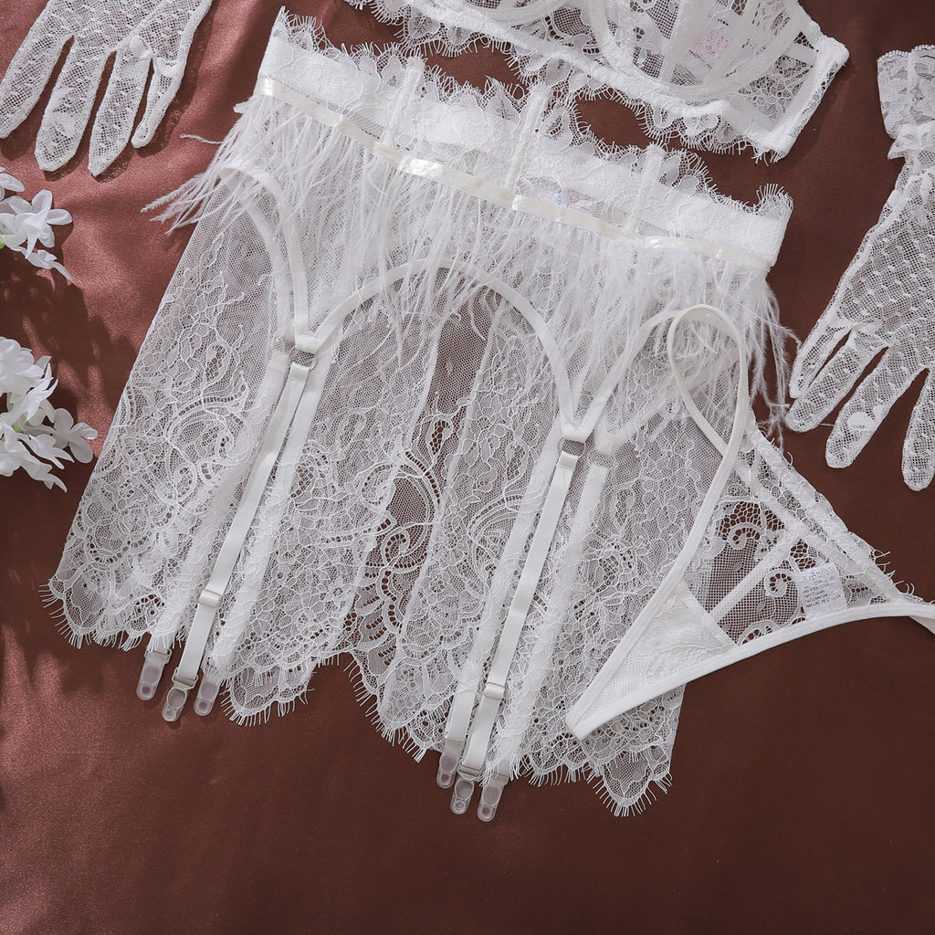 Detailed texture shot of the Weightless Hour garter belt, focusing on the airy white feathers and semi-sheer lace skirt.