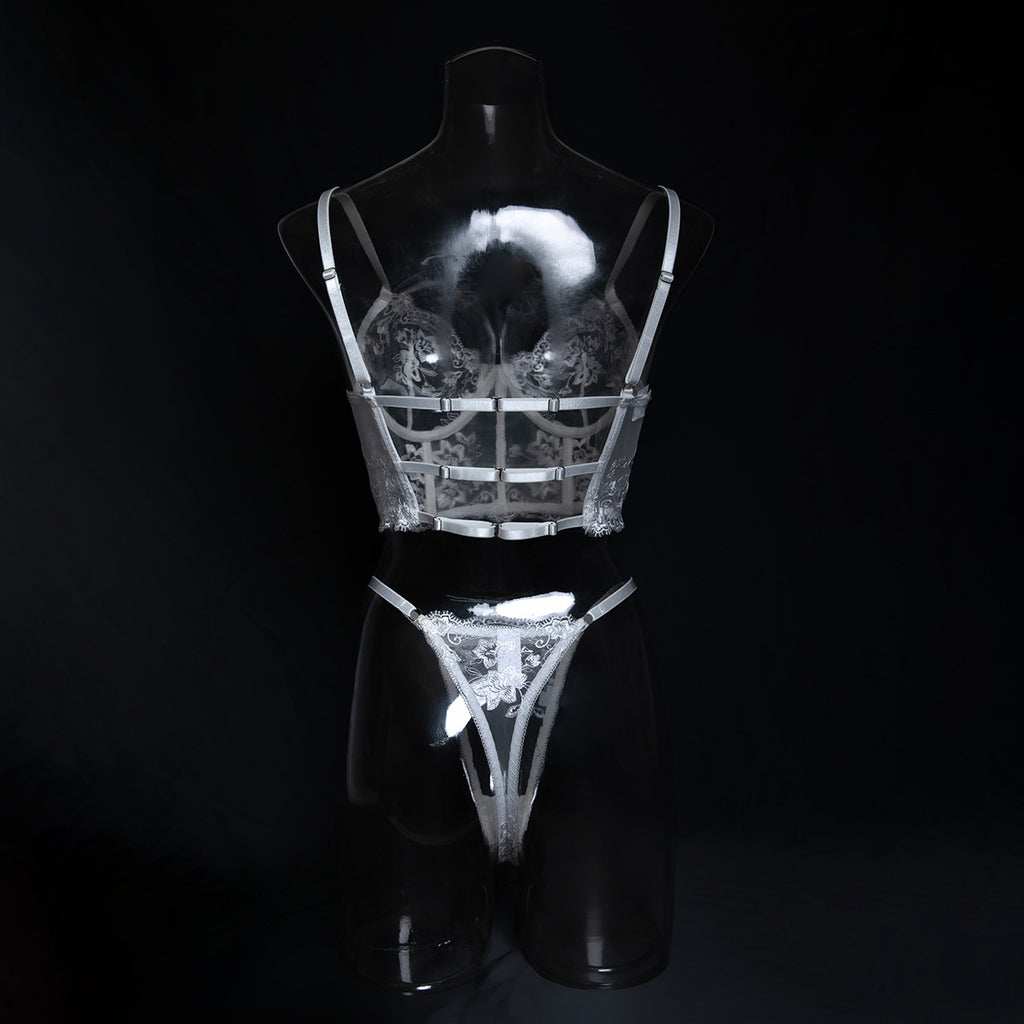 Back view of the white floral bustier, demonstrating the breathable structure that honors the natural curve.