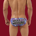 Rear view of the Wild N’ Irresistible Men's Brief on a signature burgundy background, highlighting the bold graphic statement.