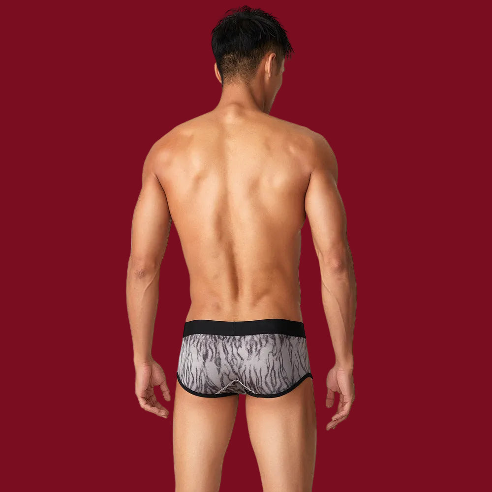 Rear profile on a signature burgundy backdrop, showcasing the sleek black waistband and seamless ash-grey tiger motif.