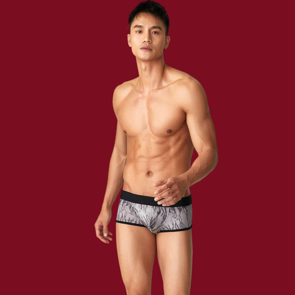 Studio flex shot against burgundy, demonstrating the high-stretch fabric and comfort of the non-irritating texture during movement.